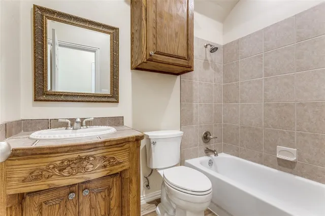 a bathroom with a sink a toilet and a bathtub