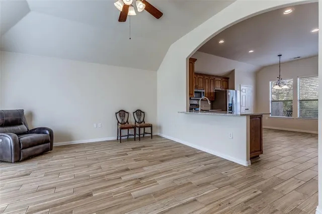 a view of a livingroom with furniture wooden floor and window