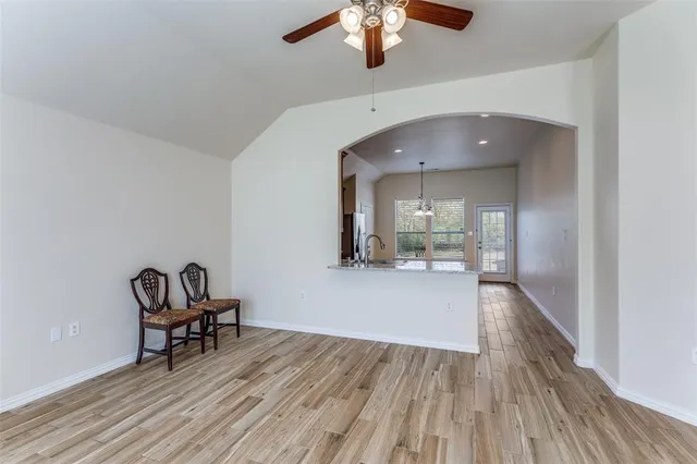 a view of dining room with furniture and chandelier