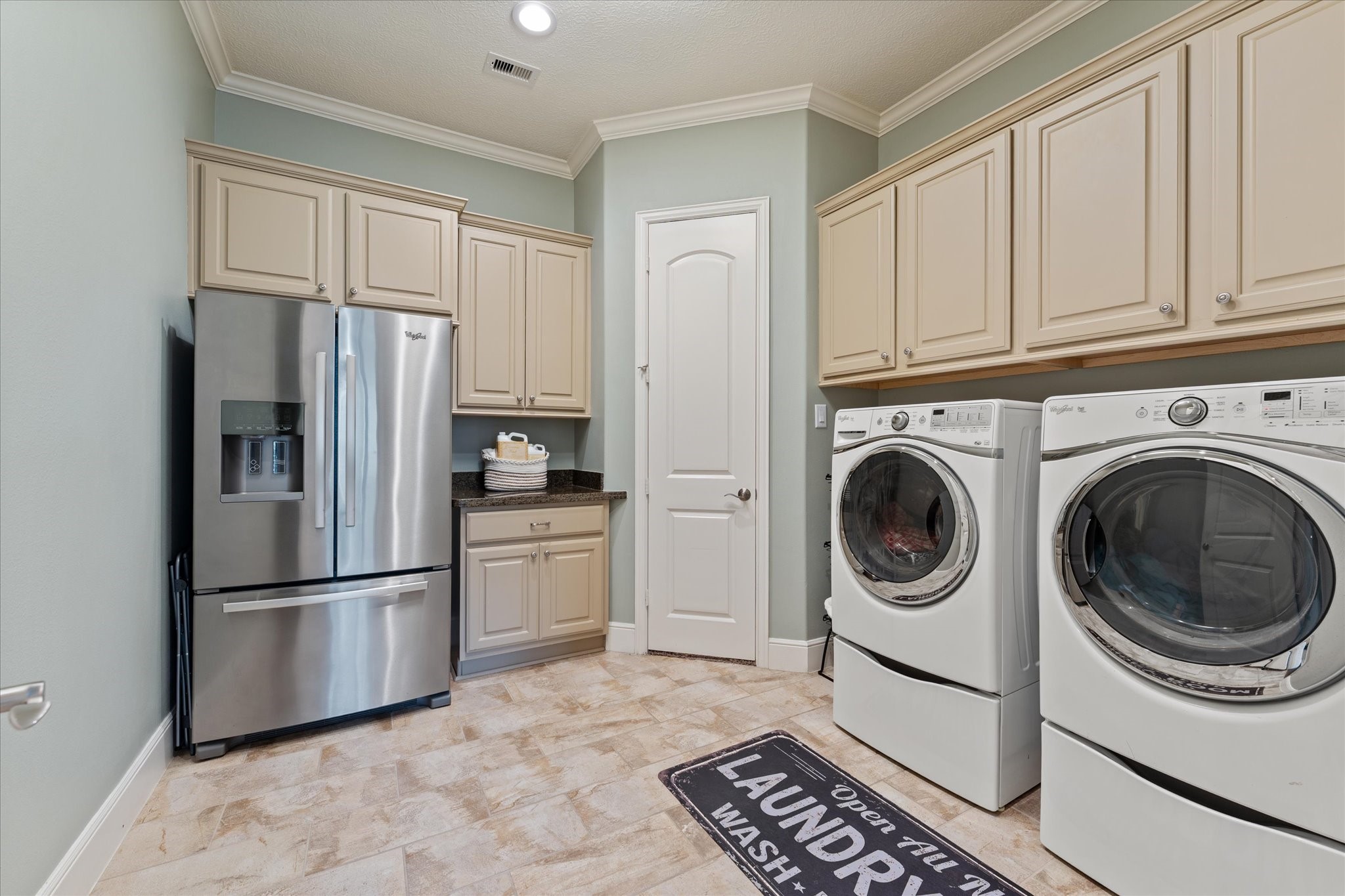 30618 Spring Lake Boulevard Tomball, TX 77375 - Photo 20 of 50 Large laundry room connected to the primary bedroom closet for convenience, also right across the hall from the large secondary bedrooms.