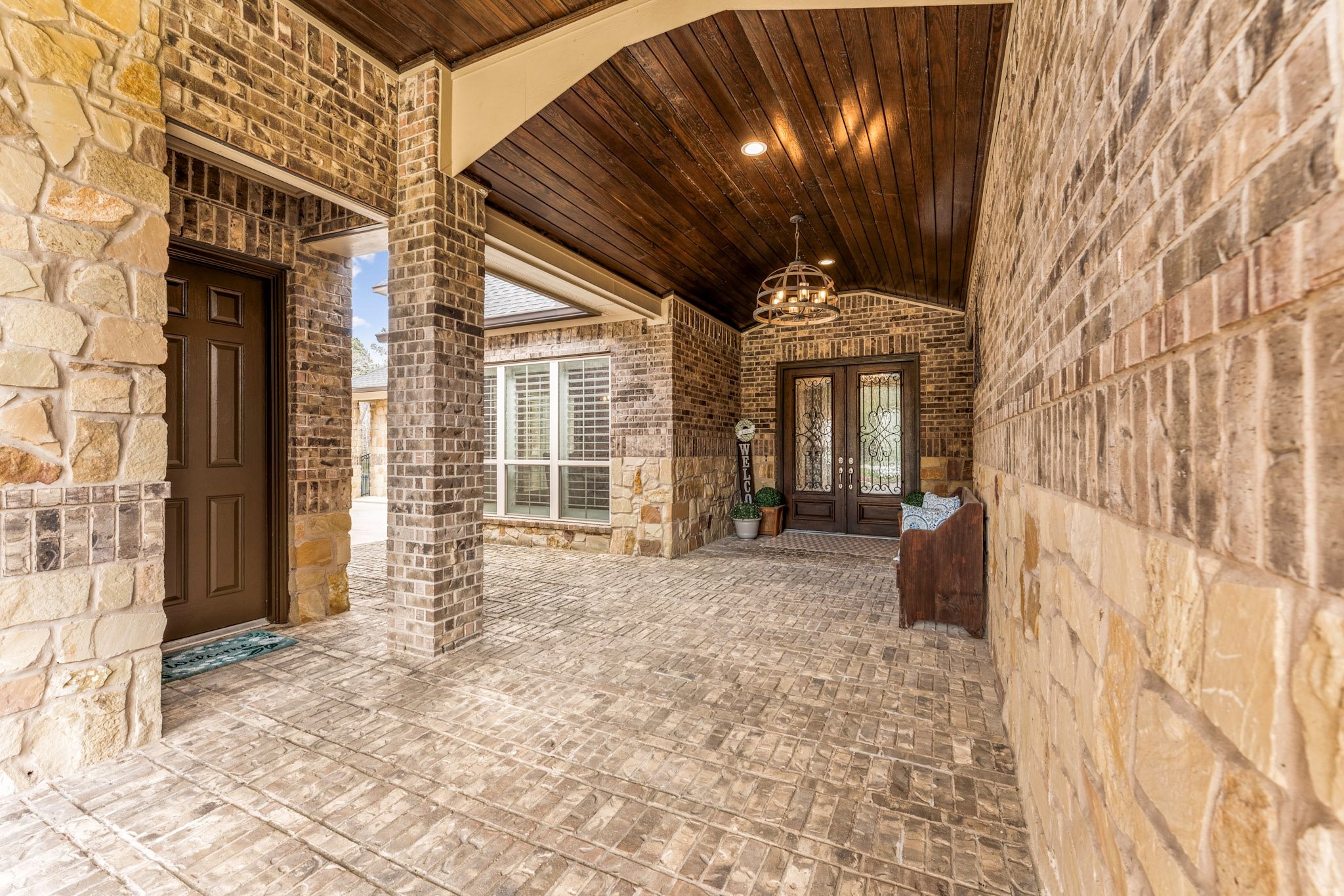 30618 Spring Lake Boulevard Tomball, TX 77375 - Photo 6 of 50 Walkway to the beautiful front entrance. Fantastic stone and ceiling details..