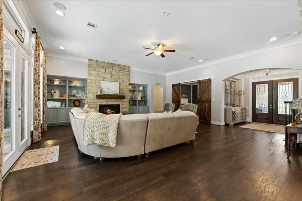 a kitchen with a refrigerator sink and cabinets