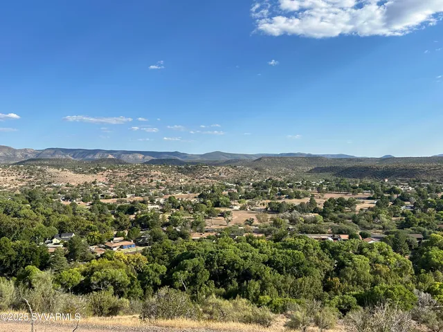 a view of a city with mountains in the background