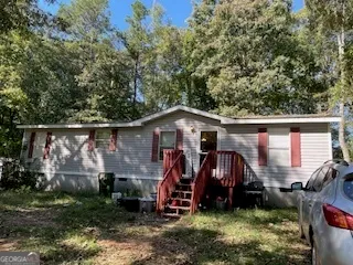 a view of a back yard of the house