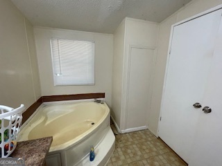 128 West Lakeview Drive Temple, GA 30179 - Photo 11 of 20 a bathroom with a tub and window