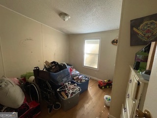 128 West Lakeview Drive Temple, GA 30179 - Photo 12 of 20 a bed room with furniture and a flat screen tv