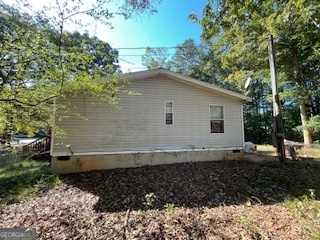 128 West Lakeview Drive Temple, GA 30179 - Photo 18 of 20 a house with trees in the background