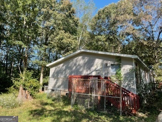 128 West Lakeview Drive Temple, GA 30179 - Photo 20 of 20 a backyard of a house with lots of green space