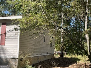 128 West Lakeview Drive Temple, GA 30179 - Photo 2 of 20 a view of a yard with plants and trees