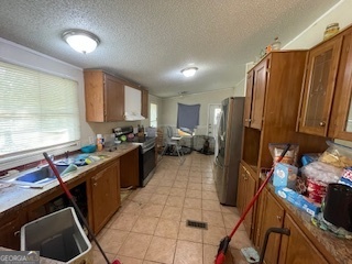 128 West Lakeview Drive Temple, GA 30179 - Photo 6 of 20 a kitchen with stainless steel appliances a refrigerator sink and cabinets