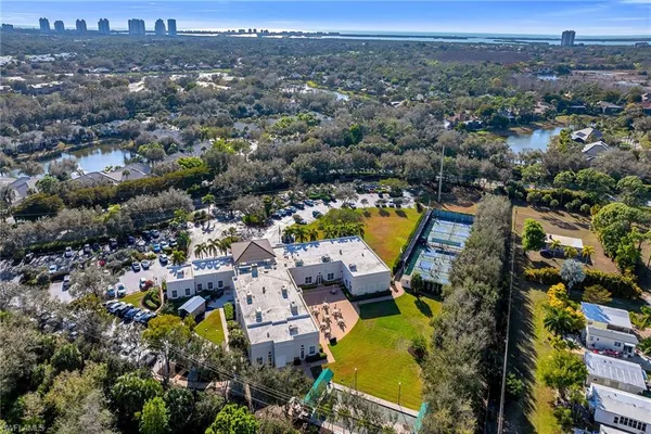 an aerial view of residential house with outdoor space and swimming pool