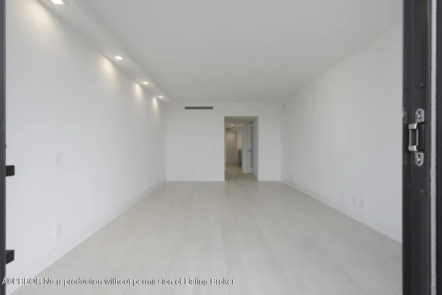 a bathroom with a double vanity sink a mirror and a bathtub