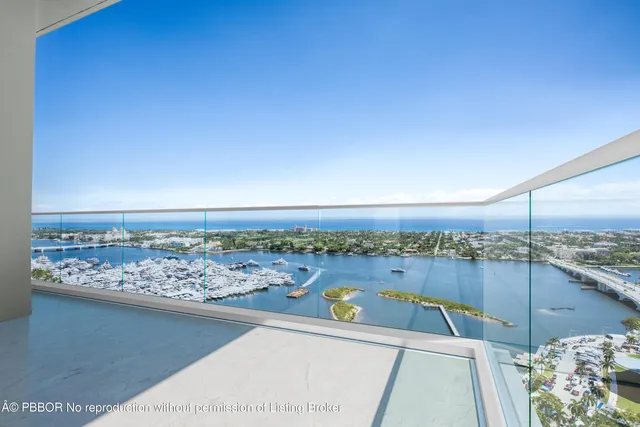 a swimming pool with outdoor seating and yard