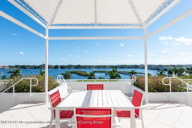 a view of a swimming pool with a bench and a porch