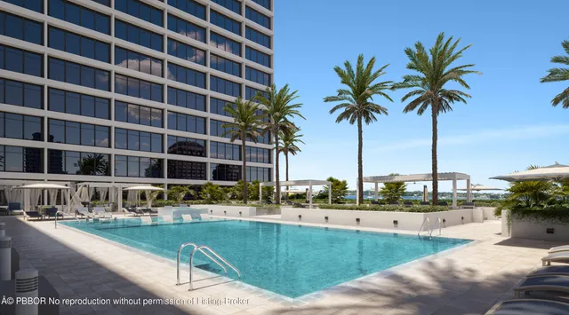 a view of a patio with a table and chairs and potted plants
