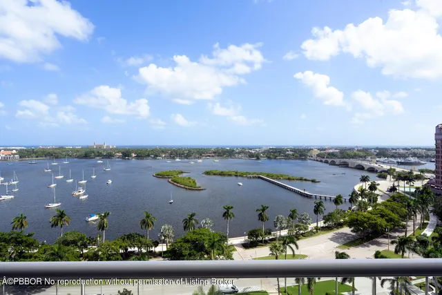 a living room with furniture and a large mirror