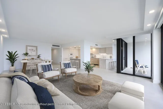 a large kitchen with stainless steel appliances kitchen island granite countertop a refrigerator and a sink