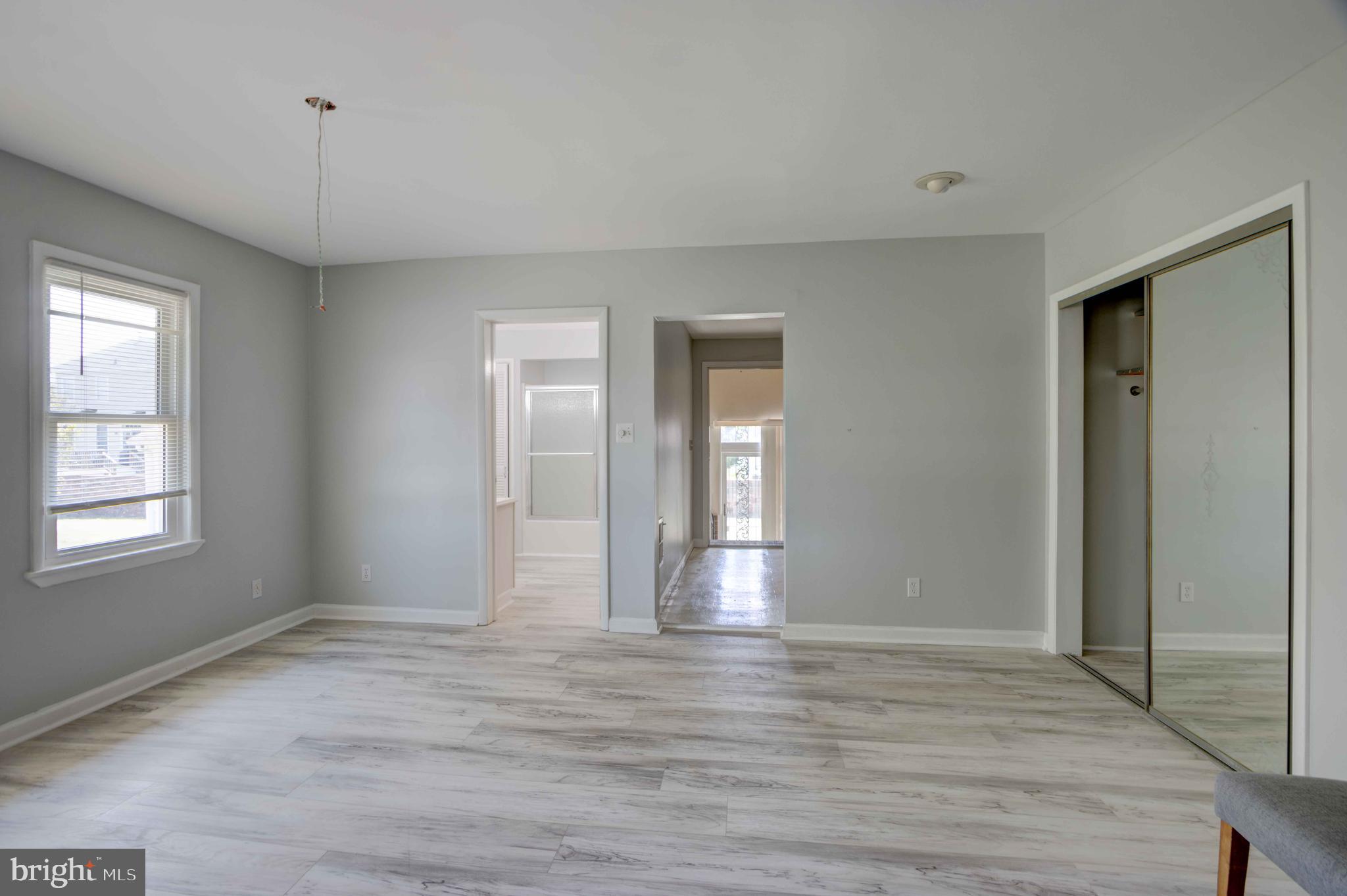 625 Hammonds Lane Baltimore, MD 21225 - Photo 11 of 40 a view of livingroom with hardwood floor and window