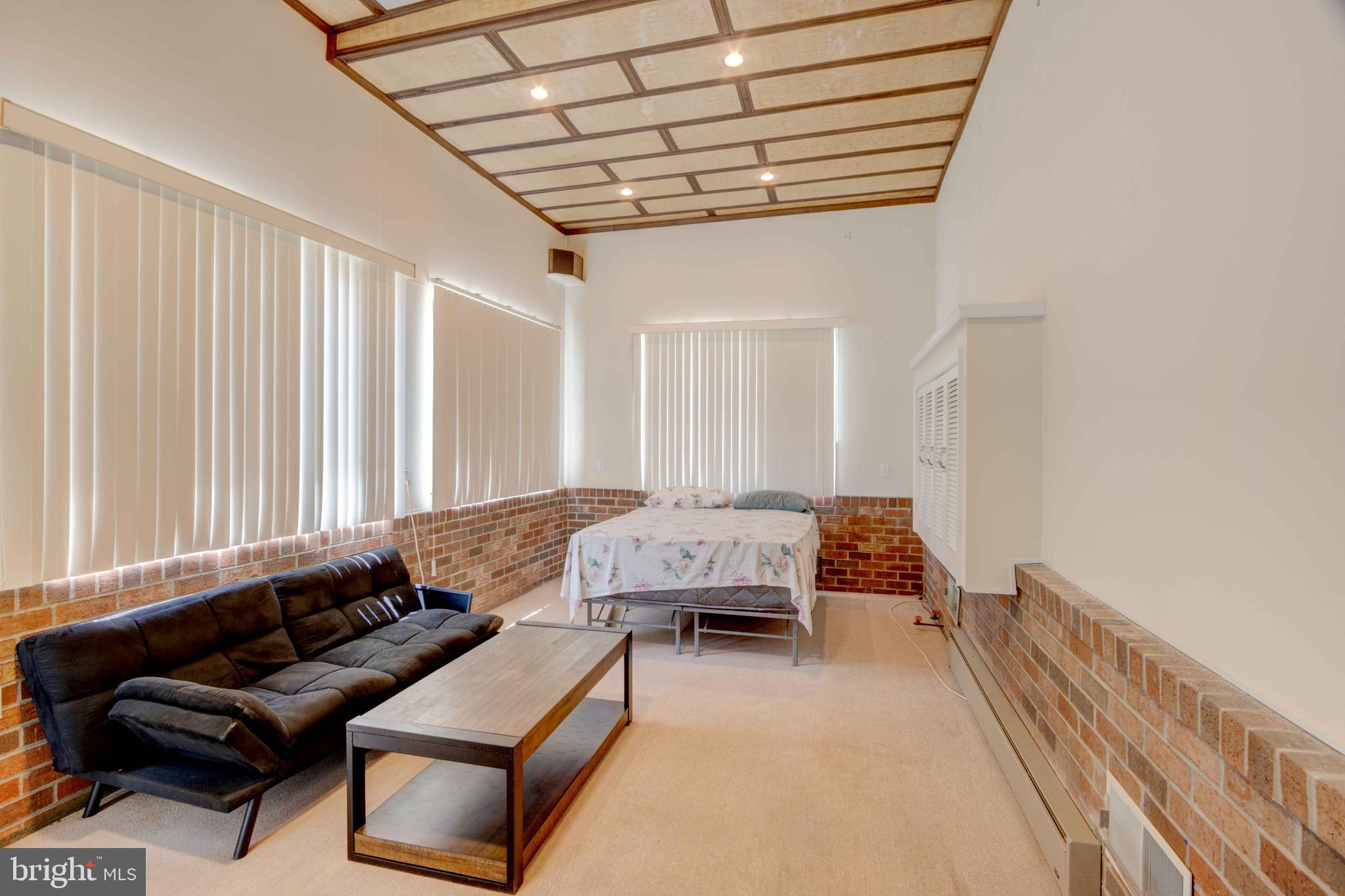 625 Hammonds Lane Baltimore, MD 21225 - Photo 29 of 40 a living room with furniture and a large window