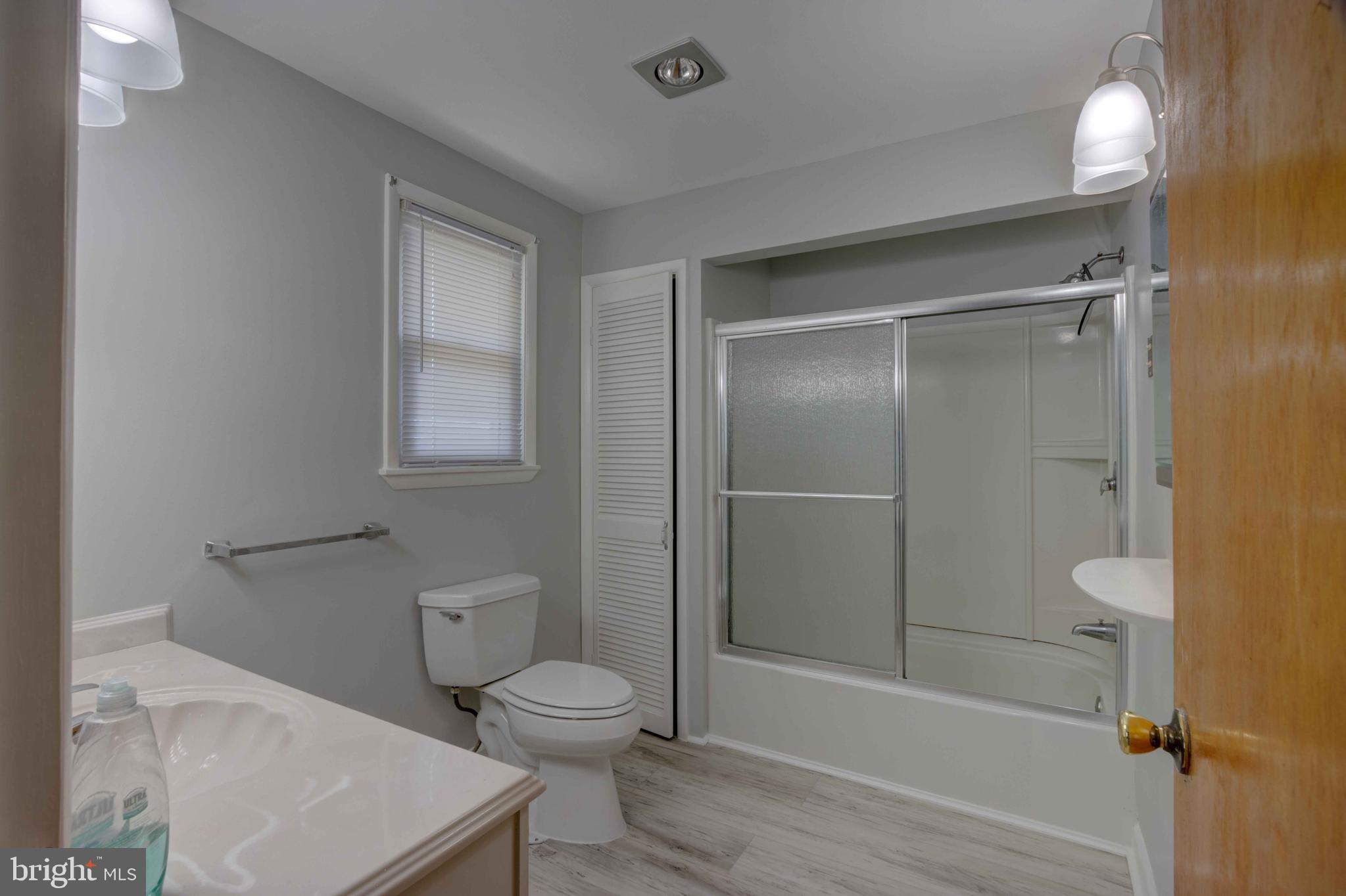 625 Hammonds Lane Baltimore, MD 21225 - Photo 8 of 40 a bathroom with a toilet and a shower