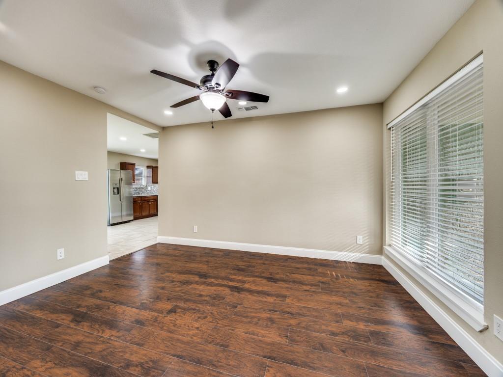 8911 Angleton Place Dallas, TX 75243 - Photo 7 of 12 wooden floor in an empty room with a window