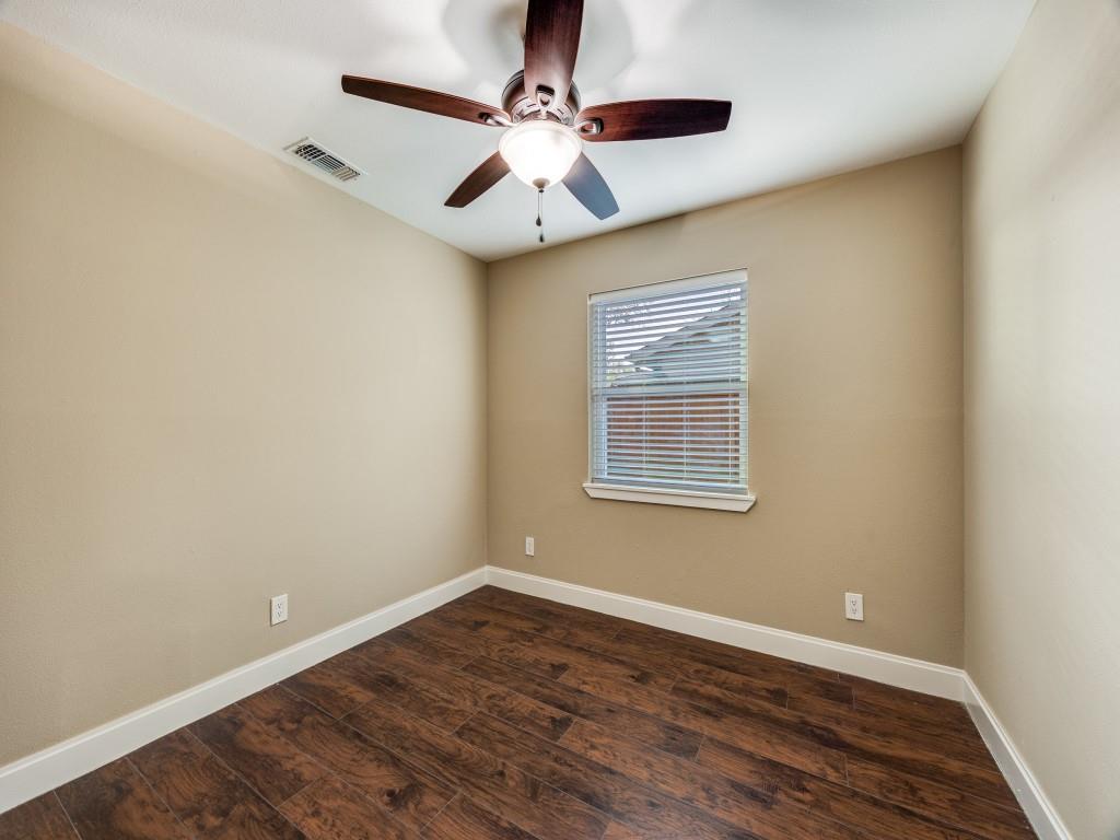 8911 Angleton Place Dallas, TX 75243 - Photo 9 of 12 wooden floor in an empty room with a window