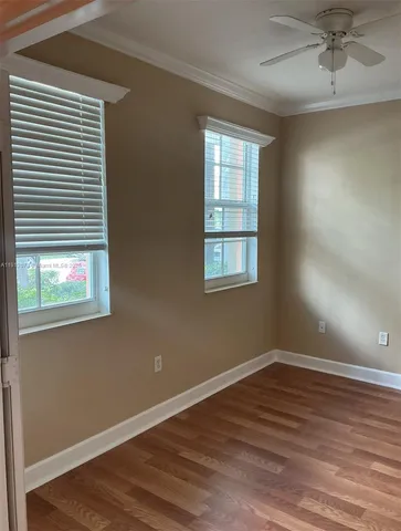a kitchen with a sink a stove and a microwave