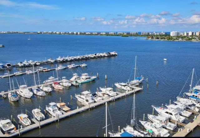 an aerial view of a houses with yard