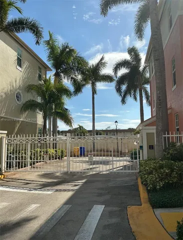 a view of a building with a yard