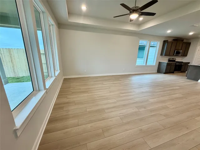 a view of an empty room with a window