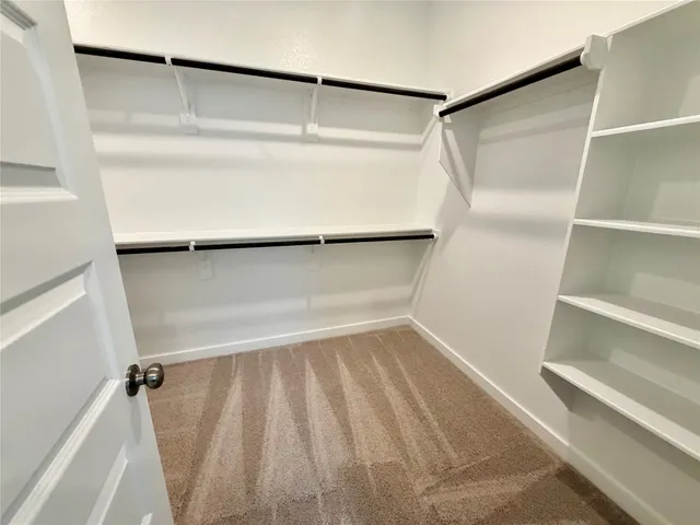 a view of an empty walk in closet
