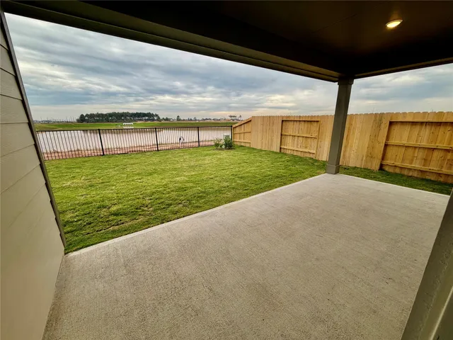 a view of swimming pool with a yard