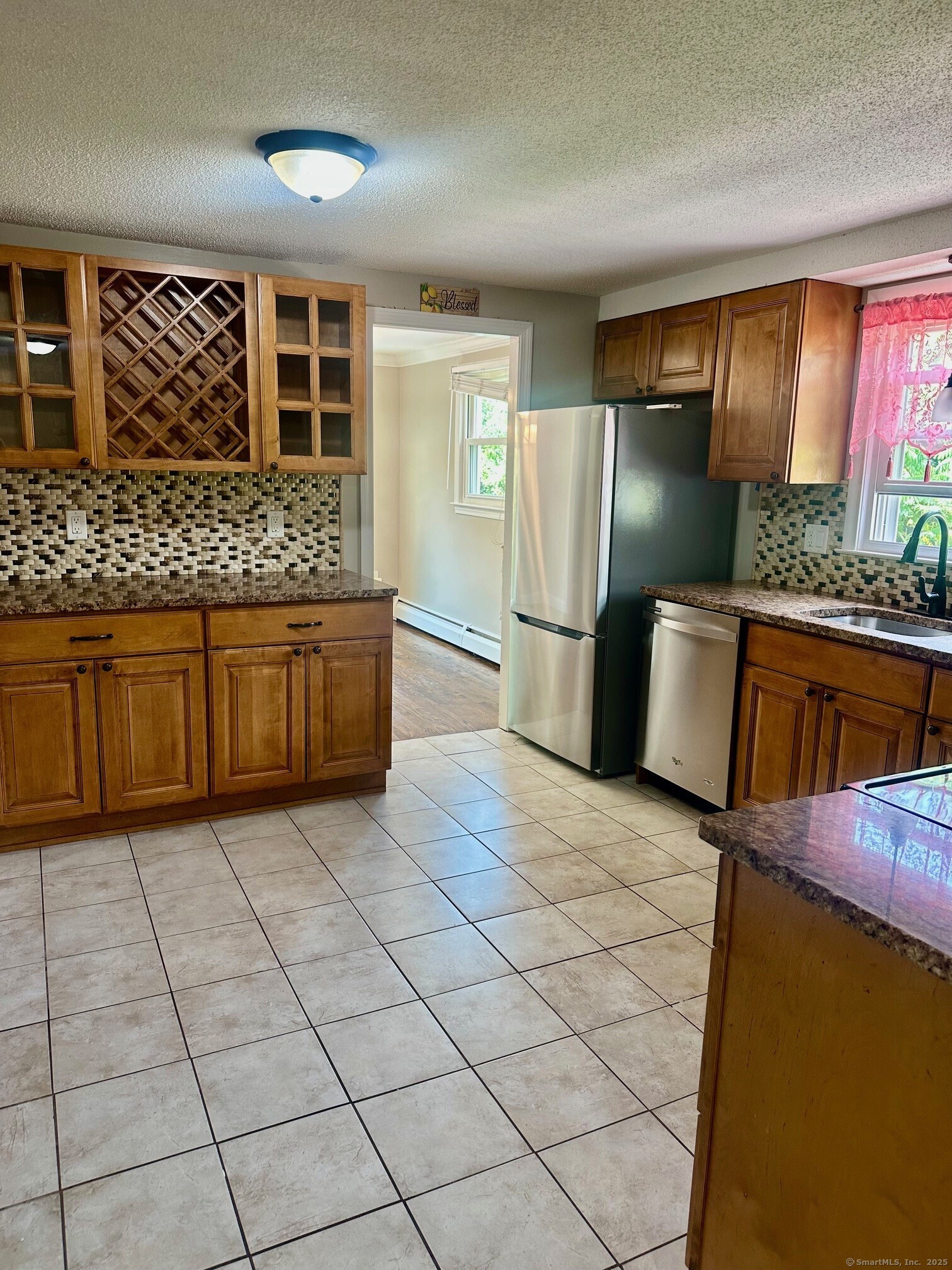 254 Sand Hill Road South Windsor, CT 06074 - Photo 3 of 20 a kitchen with stainless steel appliances granite countertop a refrigerator and a stove
