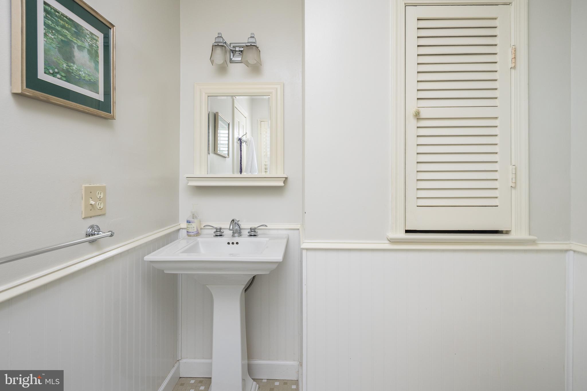 6311 Golf Course Square Alexandria, VA 22307 - Photo 15 of 39 a bathroom with a sink and a mirror
