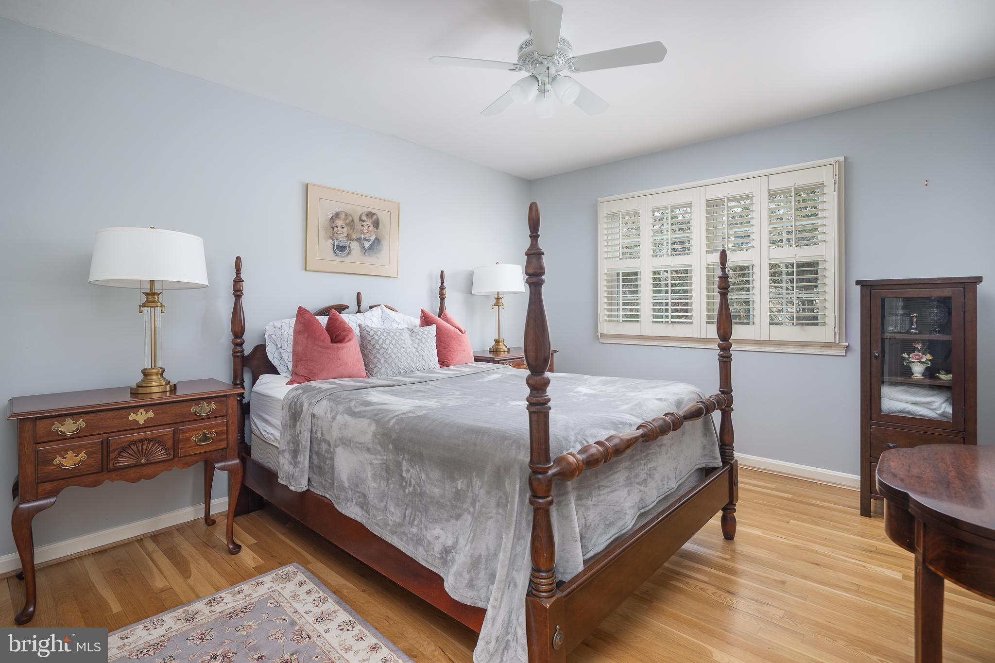 6311 Golf Course Square Alexandria, VA 22307 - Photo 16 of 39 a bedroom with a bed and wooden floor