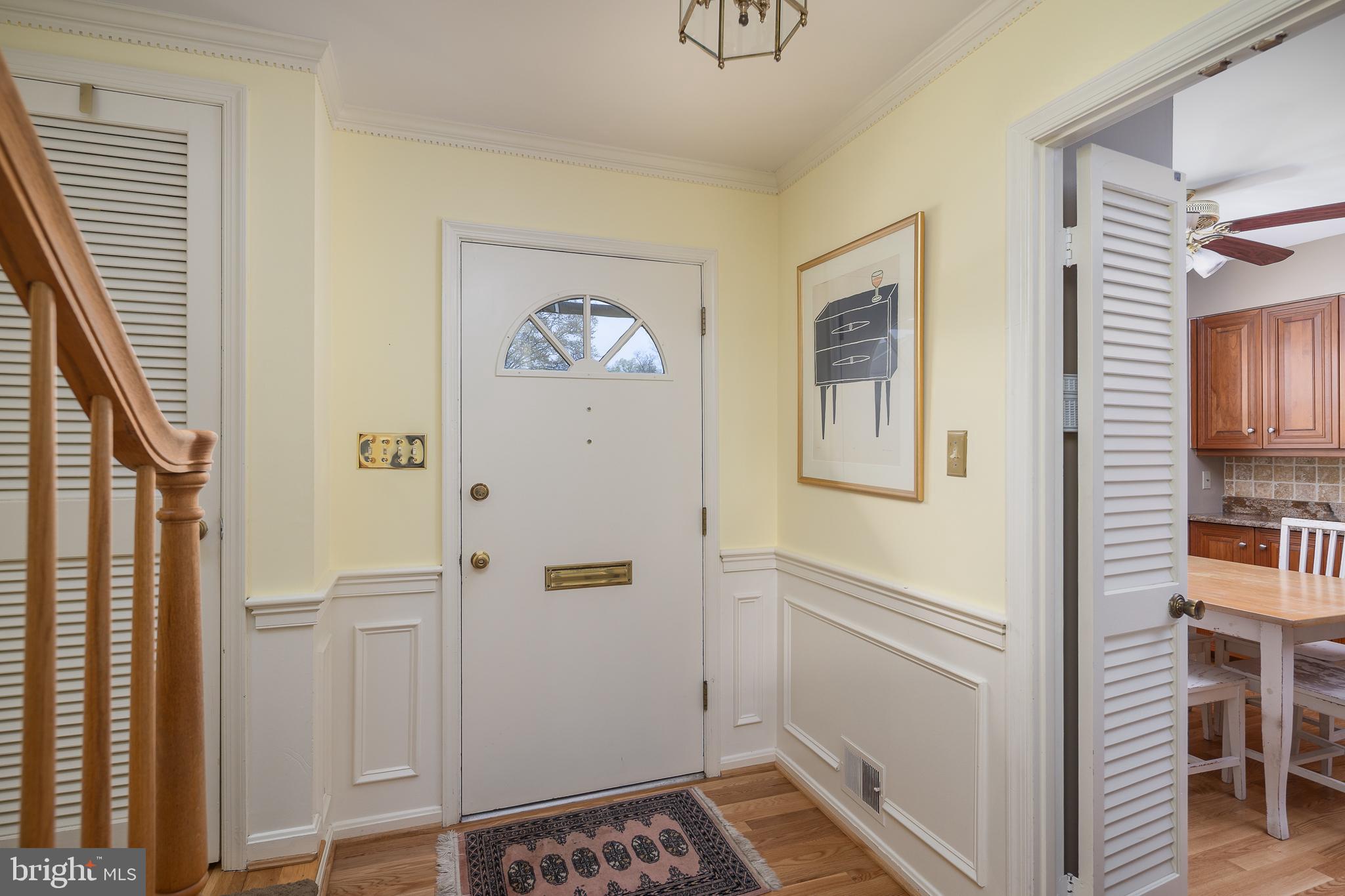 6311 Golf Course Square Alexandria, VA 22307 - Photo 2 of 39 a view of an entryway with wooden floor