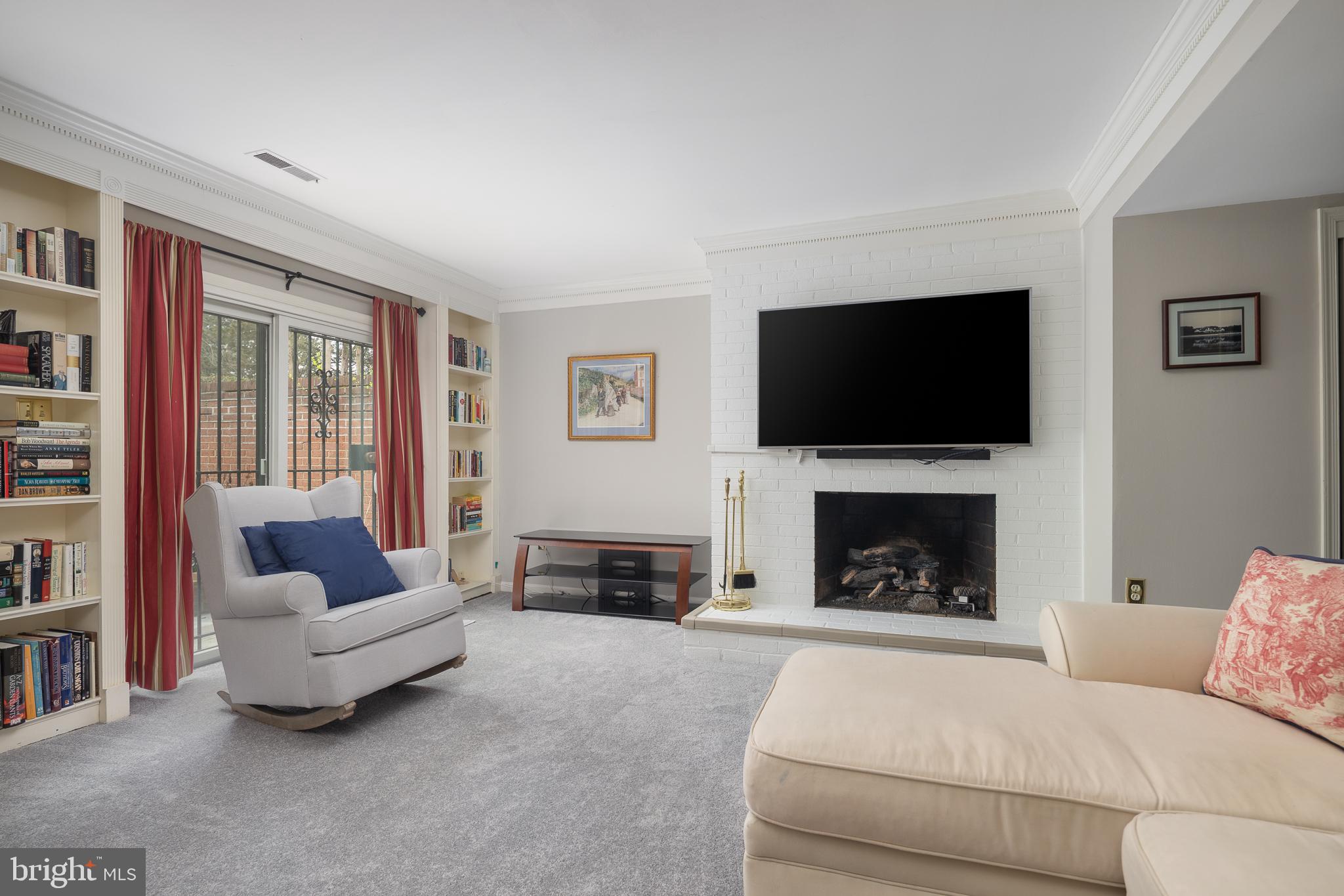 6311 Golf Course Square Alexandria, VA 22307 - Photo 22 of 39 a living room with furniture and a fireplace