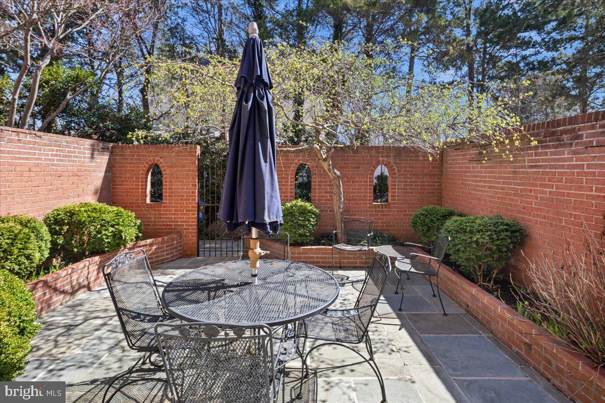 6311 Golf Course Square Alexandria, VA 22307 - Photo 27 of 39 a view of a house with backyard and sitting area