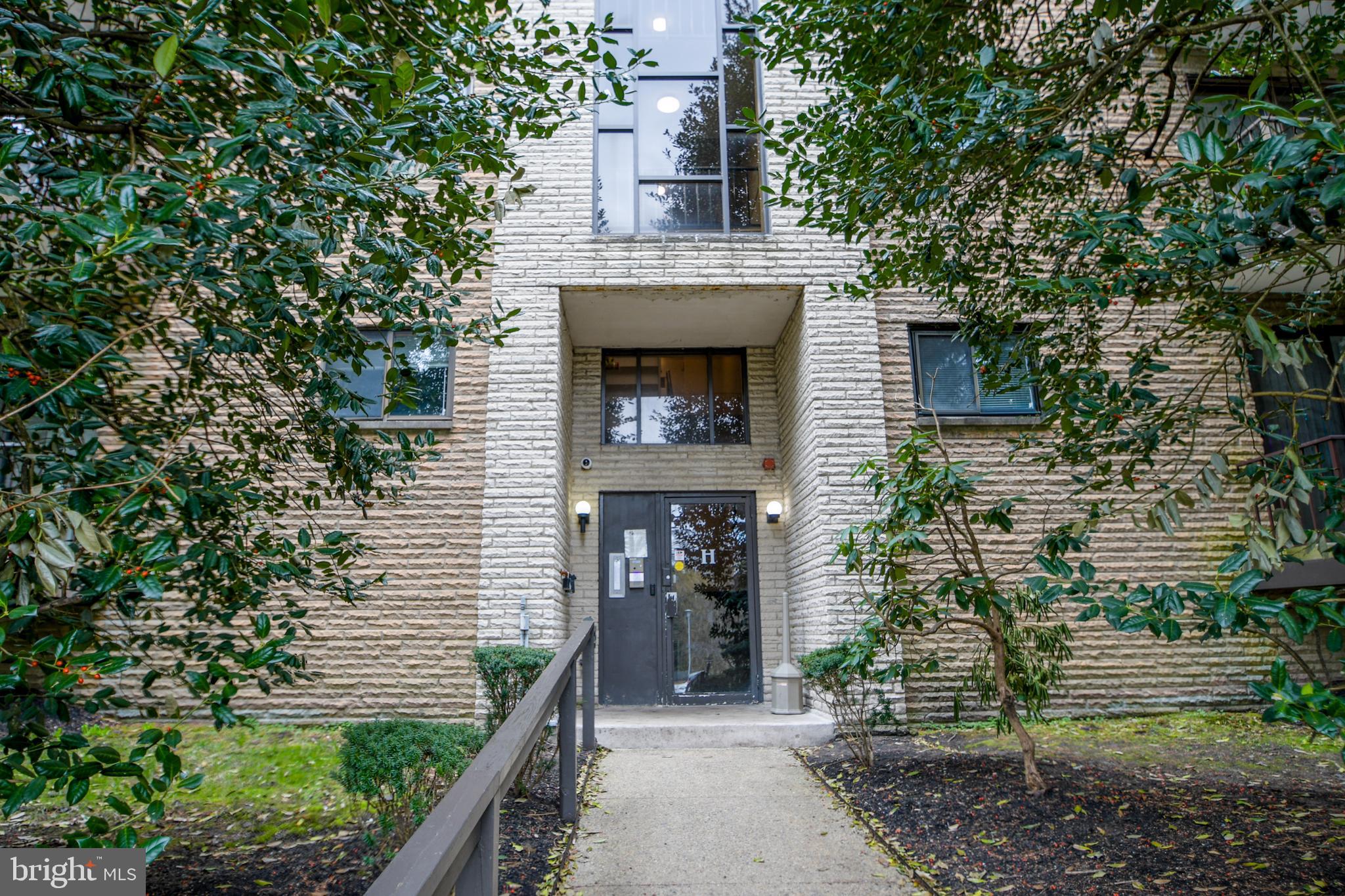 400 Glendale Road, Unit H32 Havertown, PA 19083 - Photo 1 of 1 an entrance to house with yard and green space
