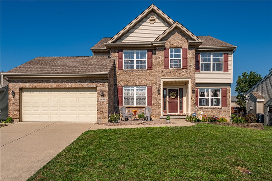 10765 Stone Ridge Way Harrison, OH 45030 - Photo 48 of 68 Brick and siding complement this inviting family home featuring a two-car garage and vibrant landscaping.