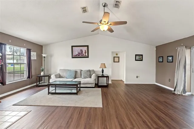 a living room with furniture and a window