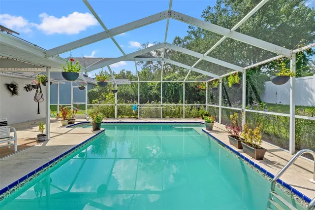 a view of a backyard with a swimming pool