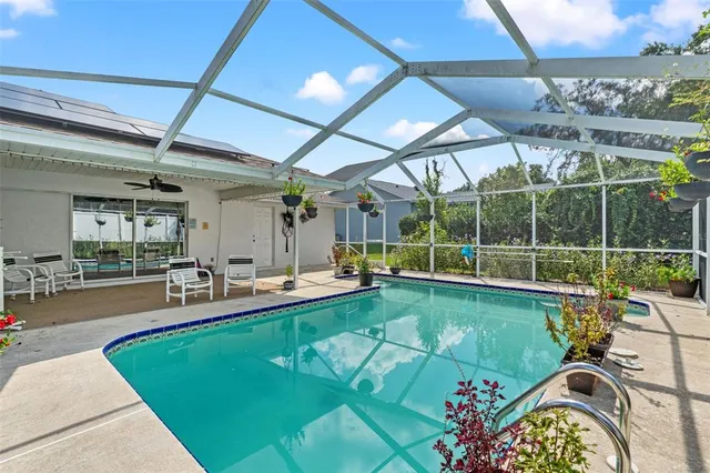 a view of a swimming pool with a patio