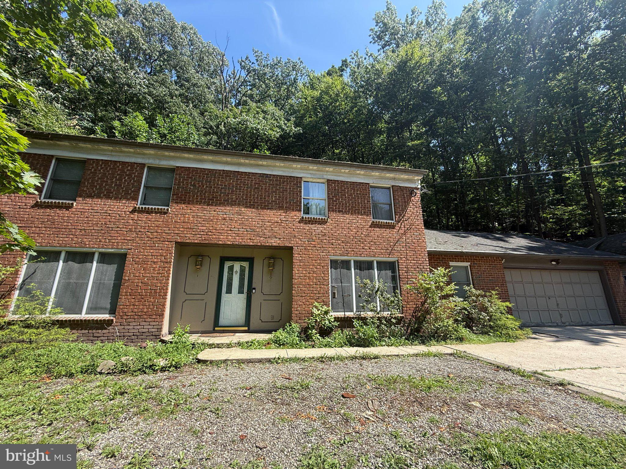 879 Sand Hill Road Hershey, PA 17033 - Photo 1 of 1 Charming brick home amid lush greenery.