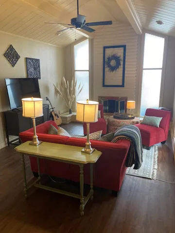 a living room with furniture and a window