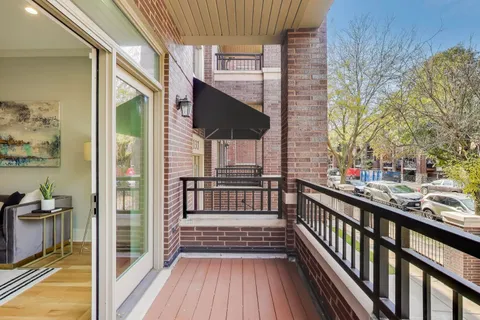 a view of a balcony with wooden floor