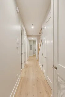 a view of a hallway with an entryway