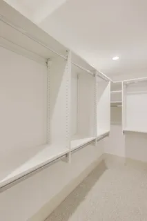 a bedroom with a bed and a lamp