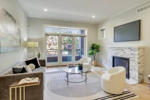 a living room with furniture fireplace and a flat screen tv