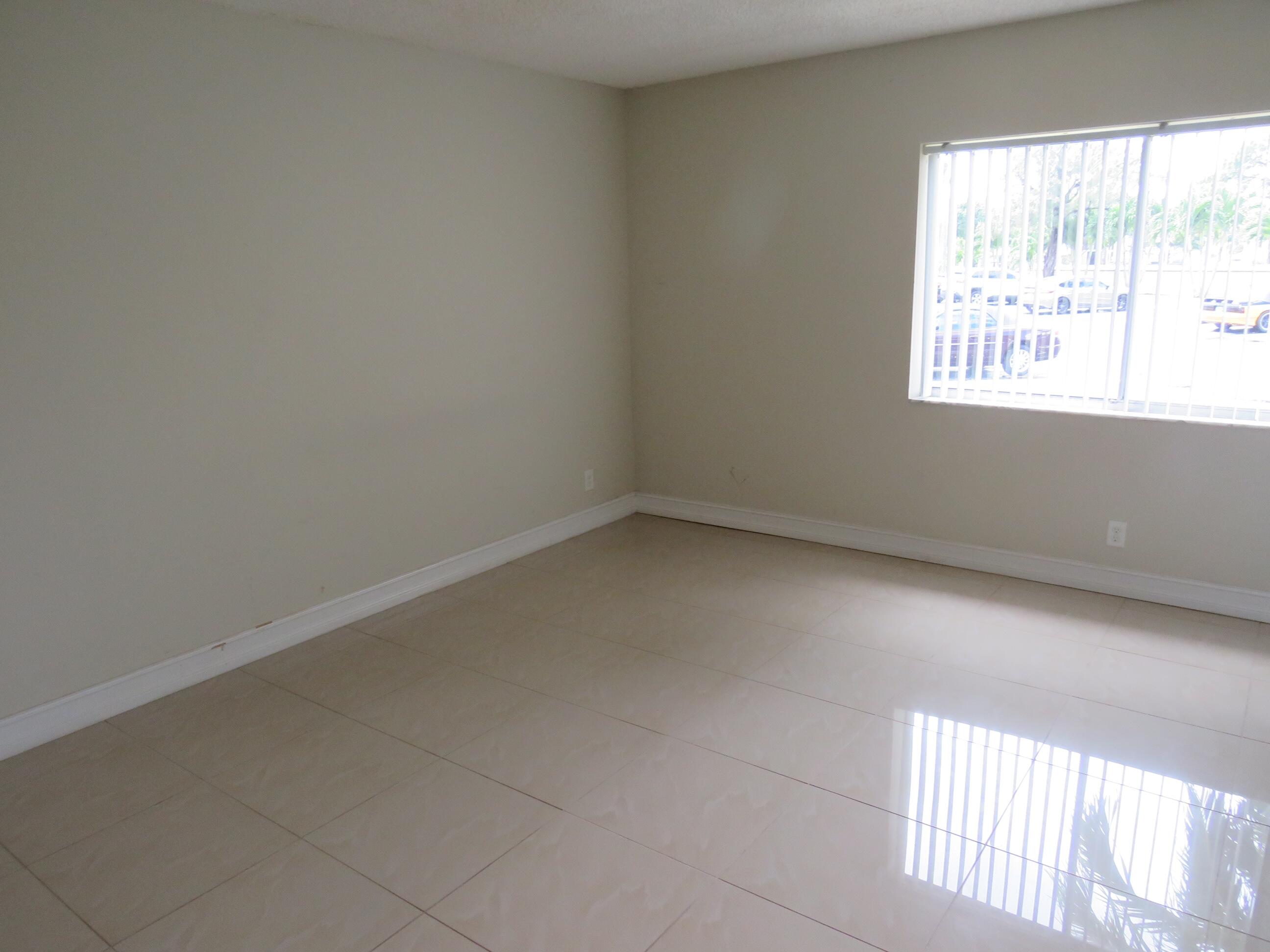 335 Pine Ridge Circle, Unit D1 Greenacres, FL 33463 - Photo 16 of 30 an empty room with a window